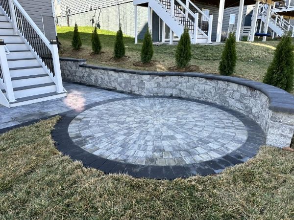 Beautiful backyard patio transformation with paver installation and professional landscaping