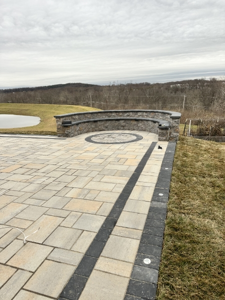 Comprehensive landscape design featuring garden beds, walkways, and expertly maintained lawn